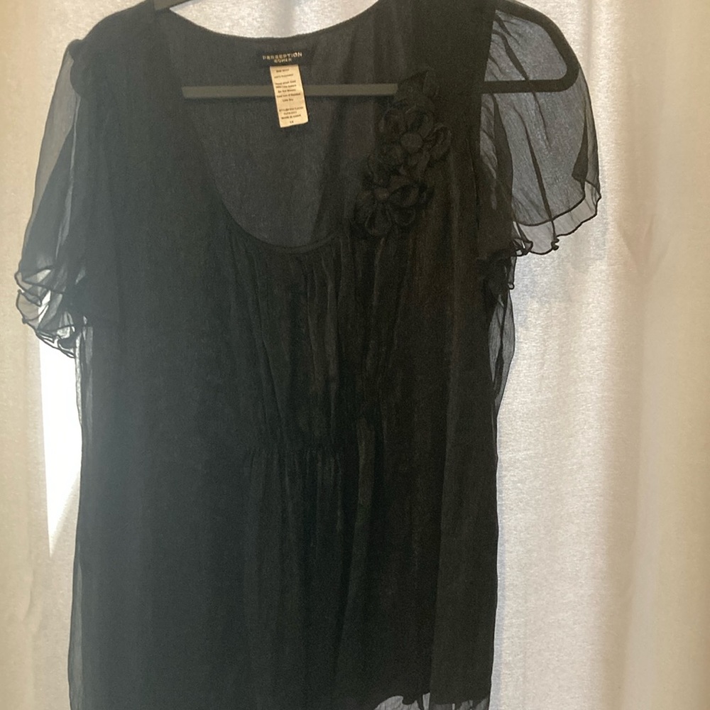 Perspection woman top. Sheer flutter sleeves, cute one sided flowers with button